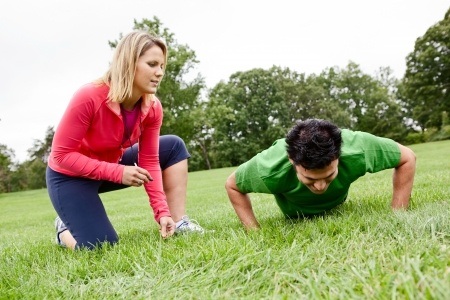 A Fast Upper Body and Core Workout for the Time Crunched Client 2 trainer coaching pushups