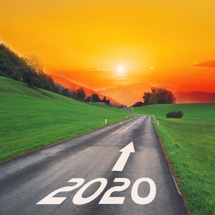 Driving On Idyllic Open Road Against The Setting Sun Forward On Goals In The Mountains To New Year 2020. Concept For Success, Passing Time And Future. Empty Asphalt Road.