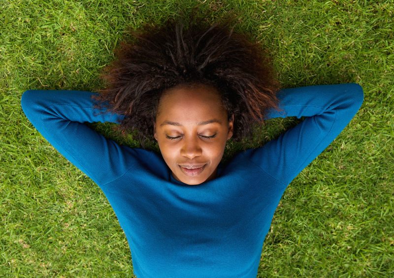 woman resting in grass