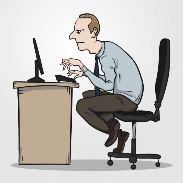 man with bad posture at desk