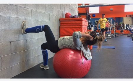 girl supine on exercise ball