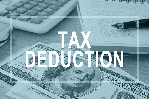 Tax Deductions. Office Table With Financial Report.