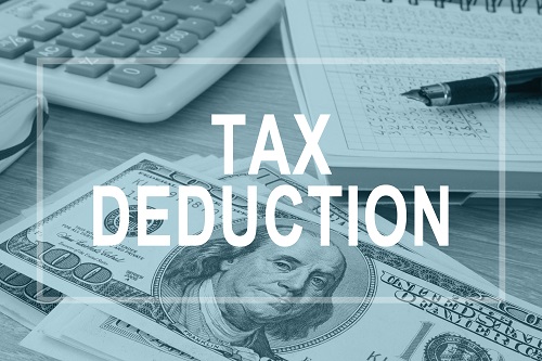 Tax Write Offs For Personal Trainers 2 Tax Deductions. Office Table With Financial Report.