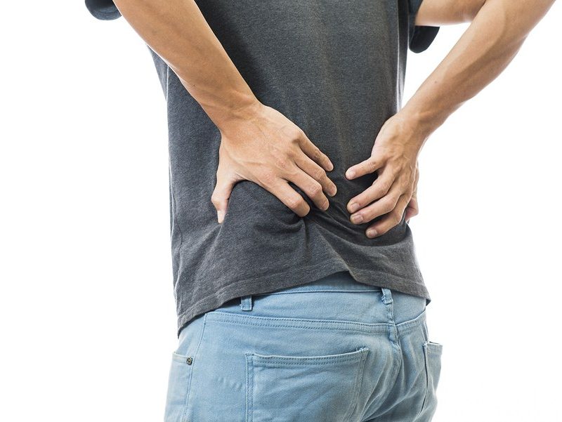 Man body discomfort lower back pain on whit background,