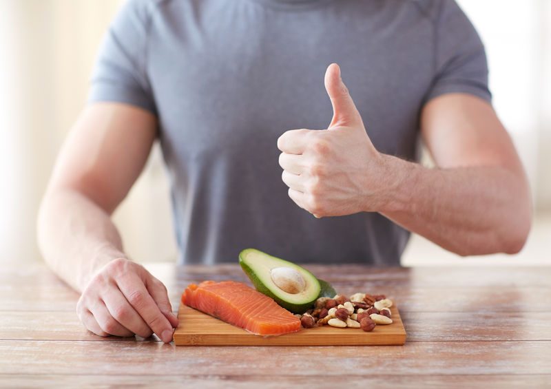 Close Up Of Male Hands With Food Rich In Protein
