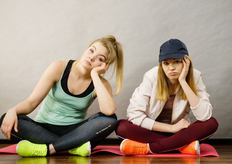 Making Workout Program Adjustments When Your Client is Bored 2 Two Sporty Women Being Bored