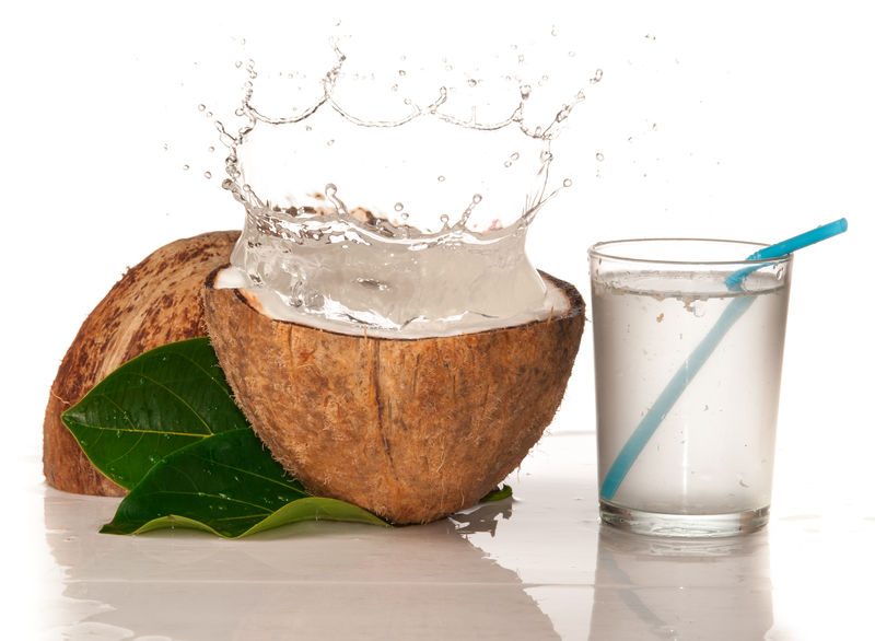 Are Water Alternatives Healthy? 2 Coconut With Water Splash Over White