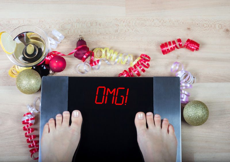 Digital Scales With Female Feet On Them And Sign"omg!" Surrounde