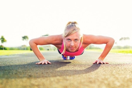 athletic woman doing pushup