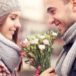 A Picture Of A Man Giving Flowers To His Lover On A Winter Day